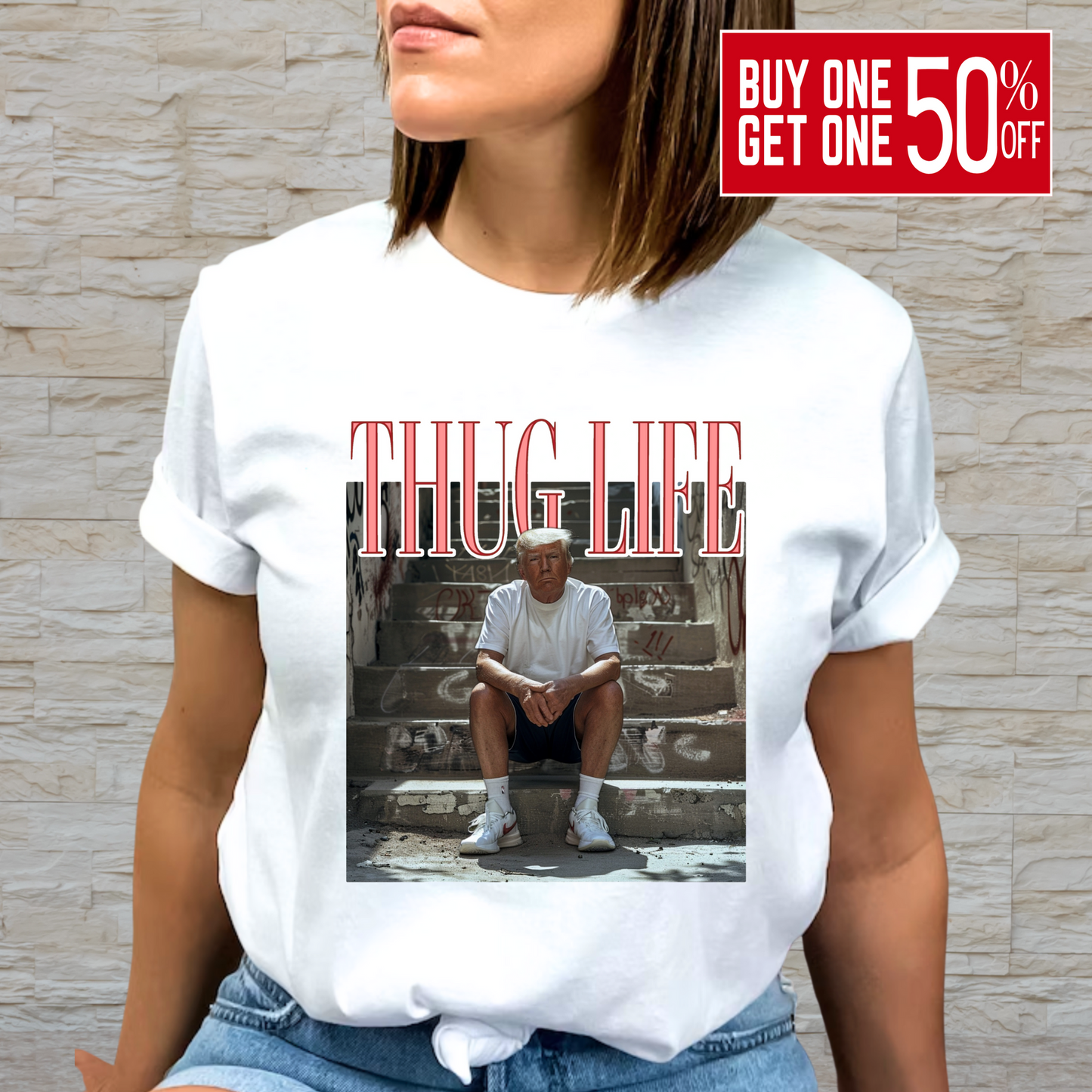 A person wearing a white crew neck t-shirt with a graphic print of a man sitting on steps and the text 'THUG LIFE' above the image.