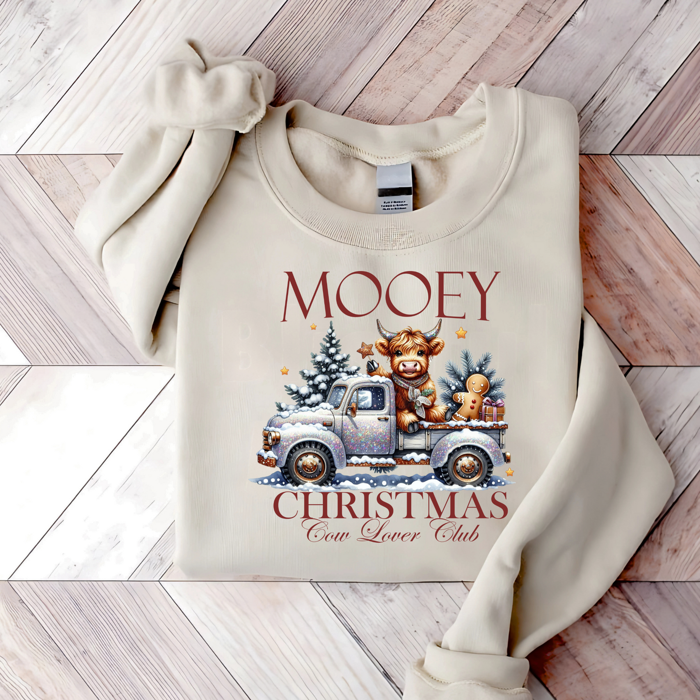 Light Sand sweatshirt with βMooey Christmas Cow Lover Clubβ graphic