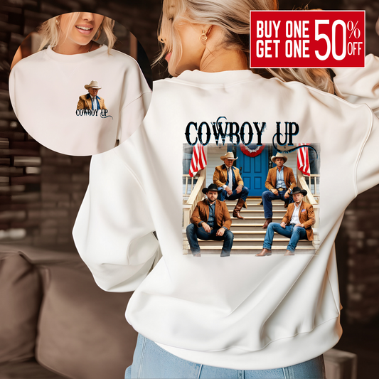 Woman wearing black “Cowboy Up” sweatshirt with large back cowboy porch graphic and front cowboy chest print