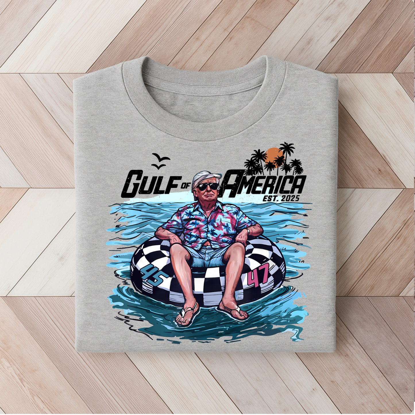 Sport gray Trump 47 tee with Gulf of America tropical float print, perfect for patriotic summer wear.