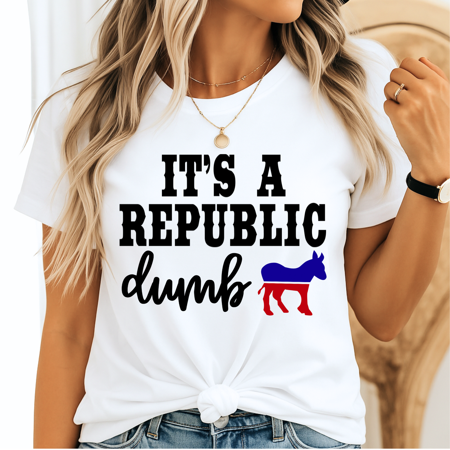 White shirt with "It’s a Republic Dumb" design worn by woman