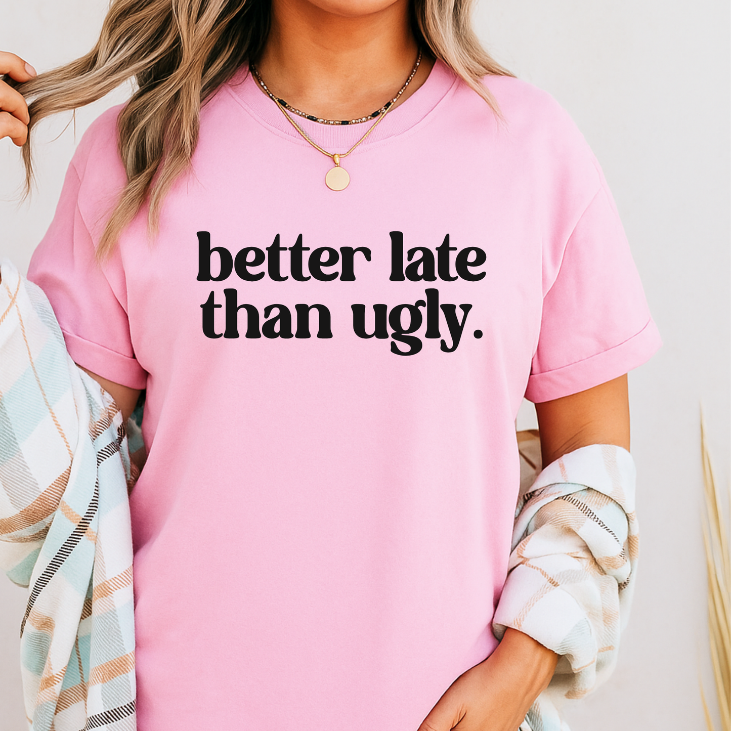 Pink t-shirt styled with plaid cardigan – confident quote tee for women