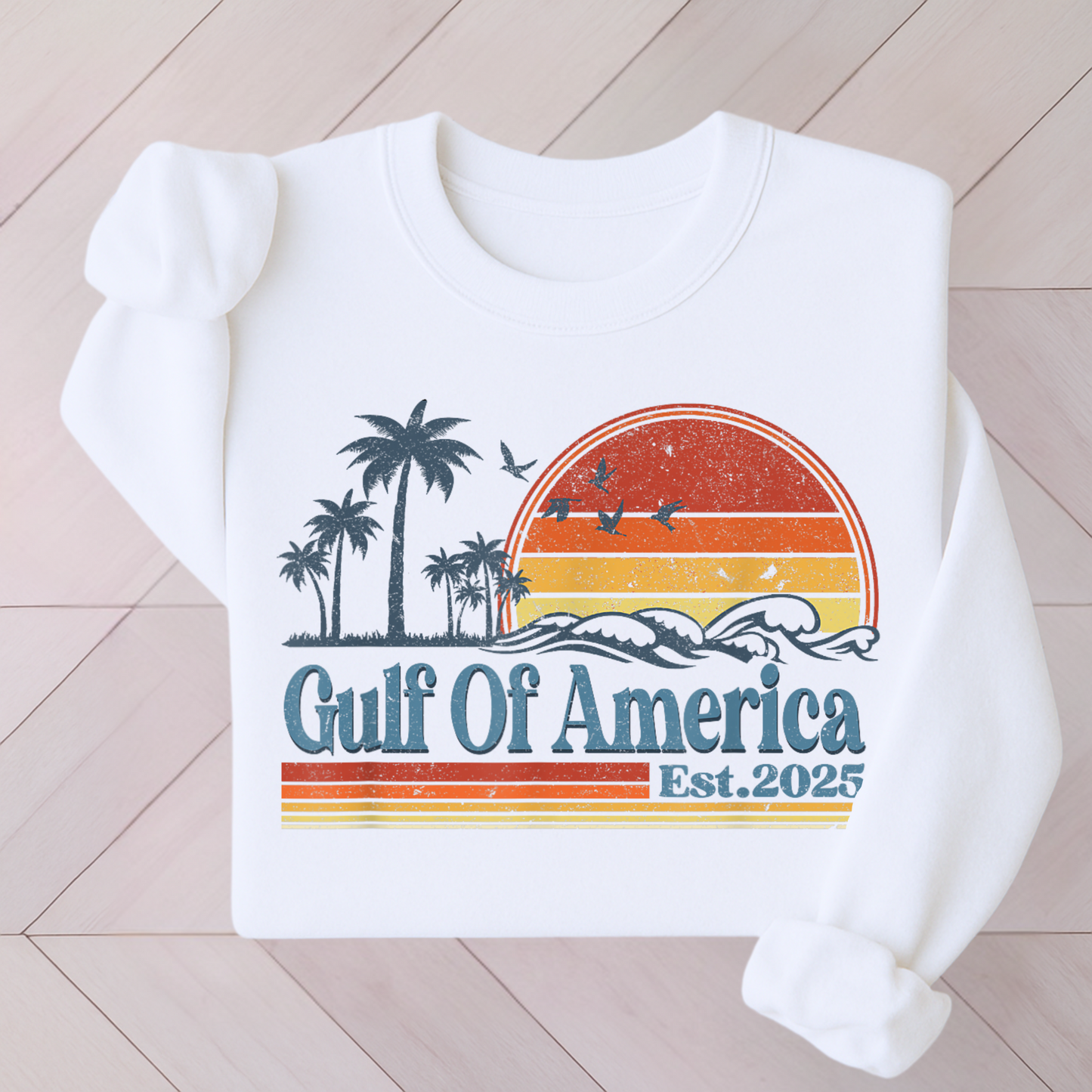 White sweatshirt featuring Gulf of America Est. 2025 red white blue graphic