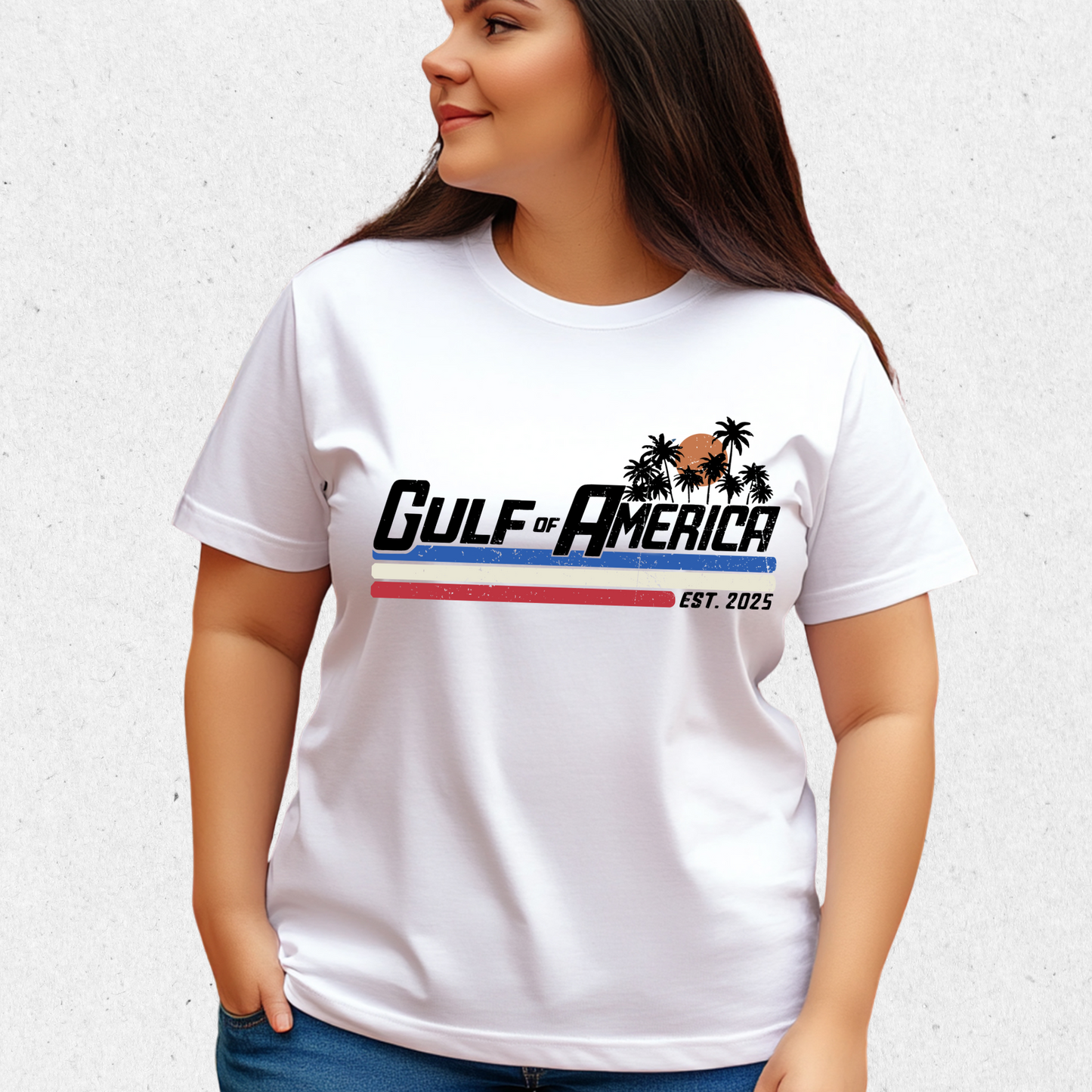 Woman wearing white Gulf of America Est. 2025 T-shirt with palm tree sunset logo