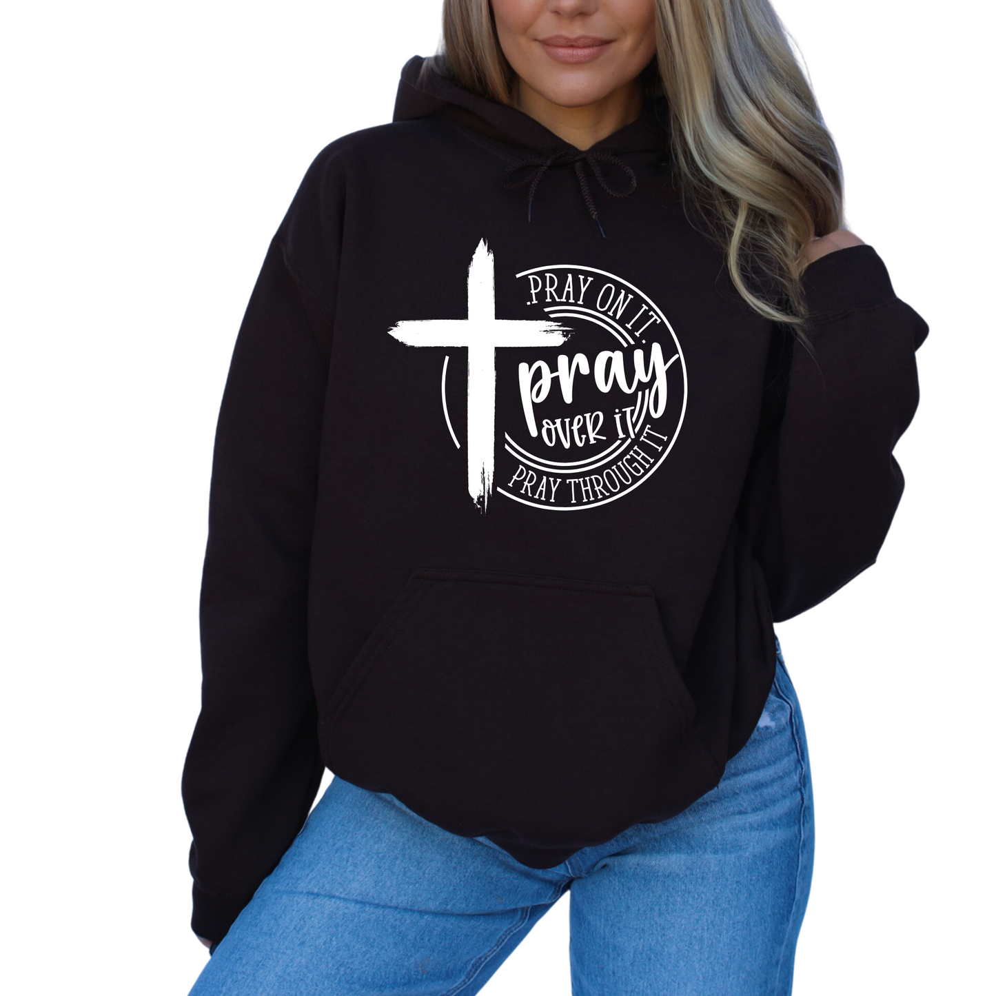 Woman wearing a Black Christian hoodie with a motivational prayer message and cross symbol.