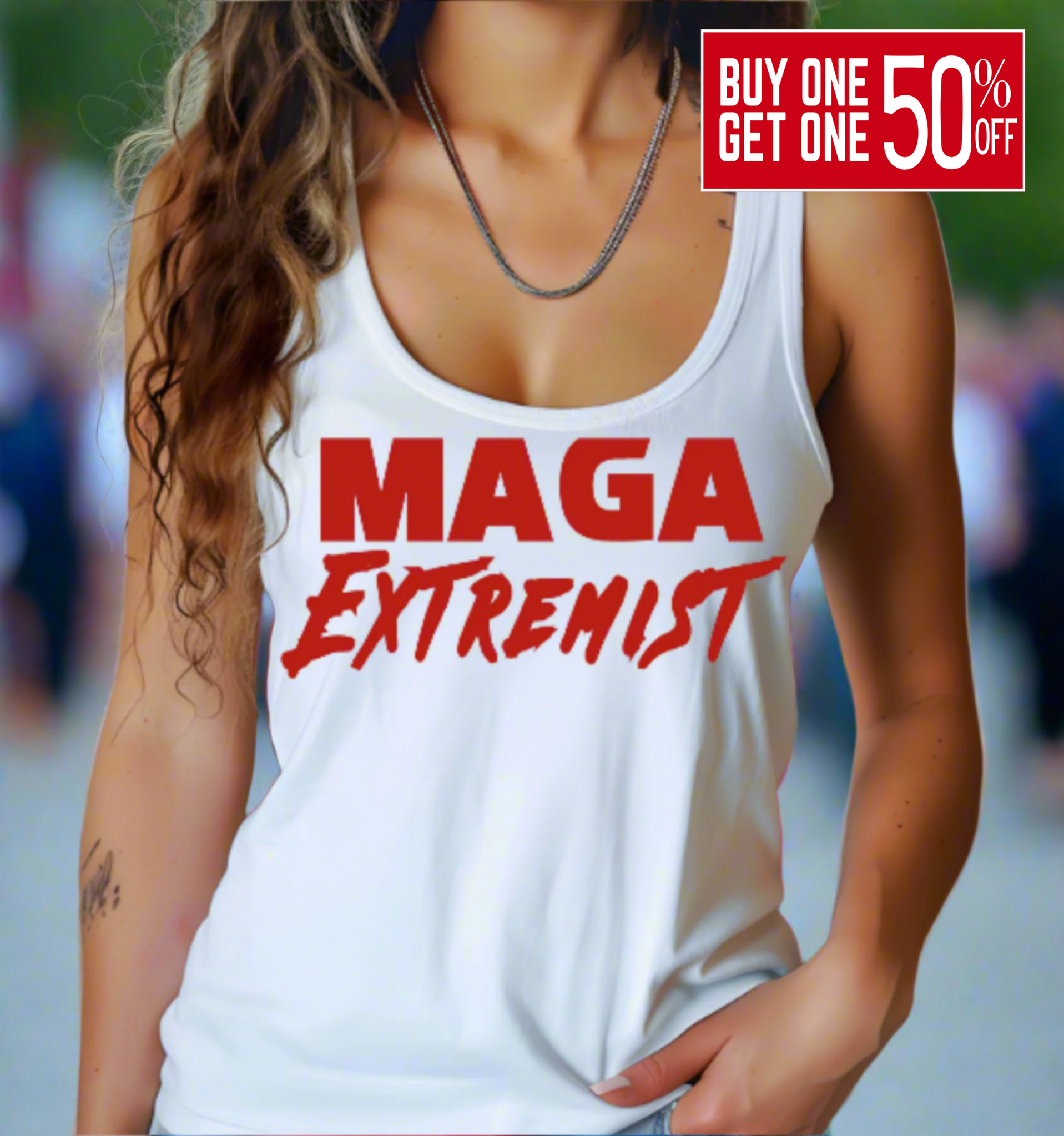 Person wearing a white tank top with 'MAGA Extremist' text, blurred background