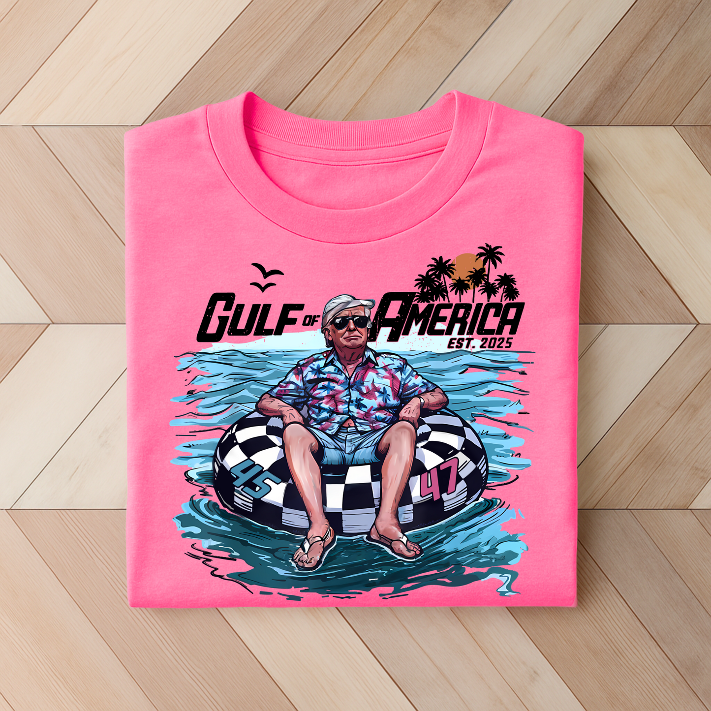 Bright pink MAGA shirt with Trump floating in an inner tube, palm trees and ocean background.
