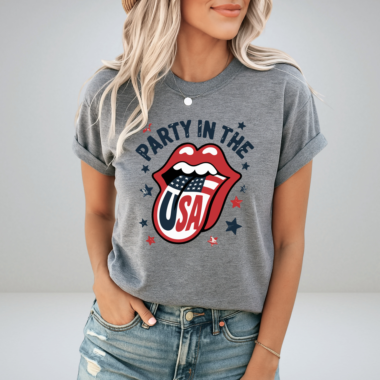 Stylish woman wearing a charcoal gray “Party in the USA” T-shirt with vintage-style patriotic lips design. Ideal for Independence Day, fireworks events, and relaxed summer Americana fashion.
