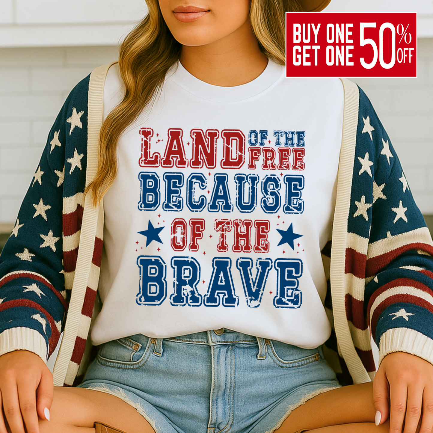 Close-up of white t-shirt with red, blue, and navy patriotic print, styled with casual denim shorts