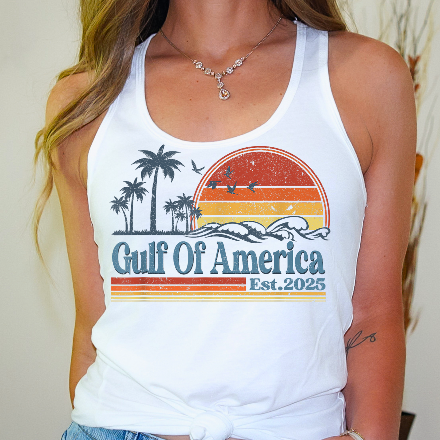 Relax in coastal style with our Gulf Of America Est. 2025 tank top. Designed for sun-seekers, ocean lovers, and those who appreciate a vintage coastal aesthetic, this soft and breathable racerback tank is perfect for summer adventures