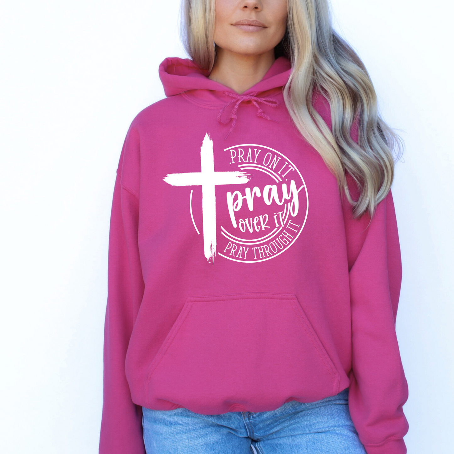 Woman wearing a Dark Pink Christian hoodie with a motivational prayer message and cross symbol.