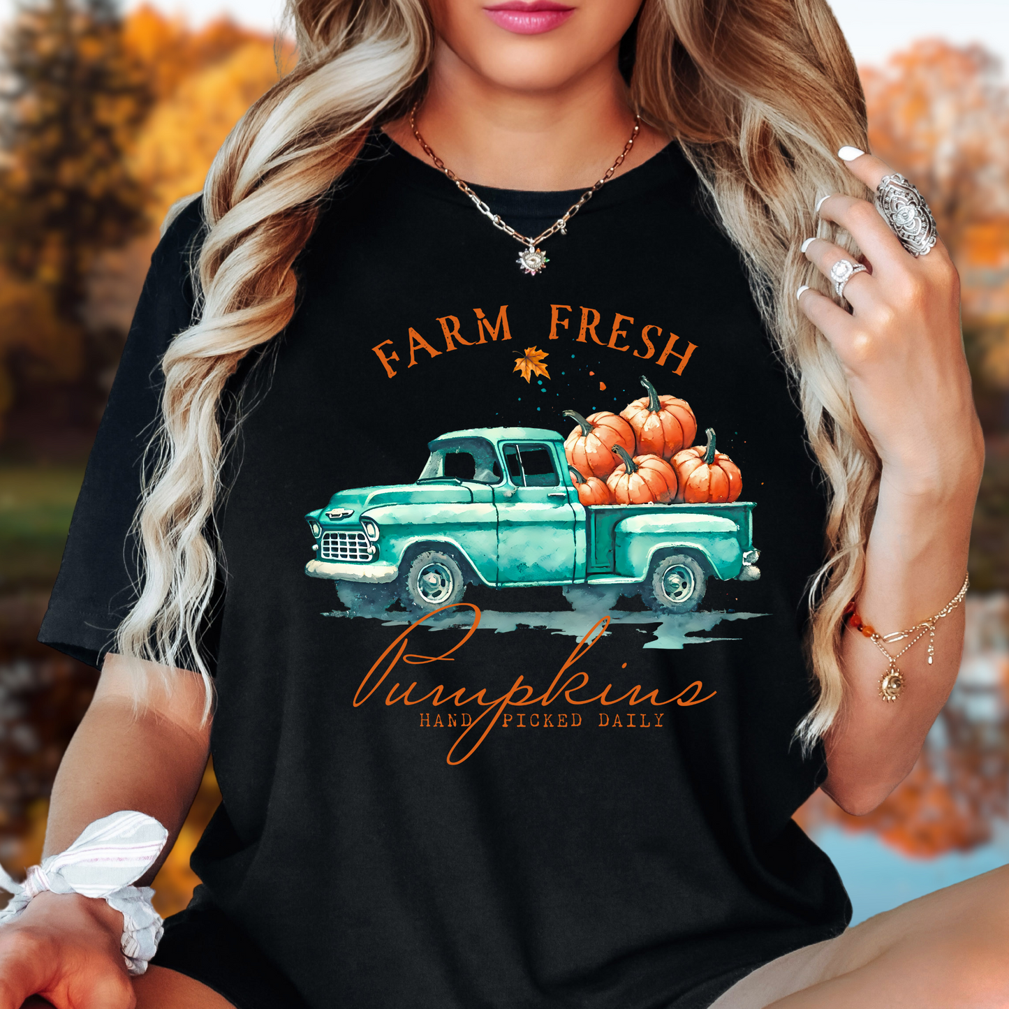 Woman in black "Farm Fresh Pumpkins" shirt styled with beanie for cozy fall look