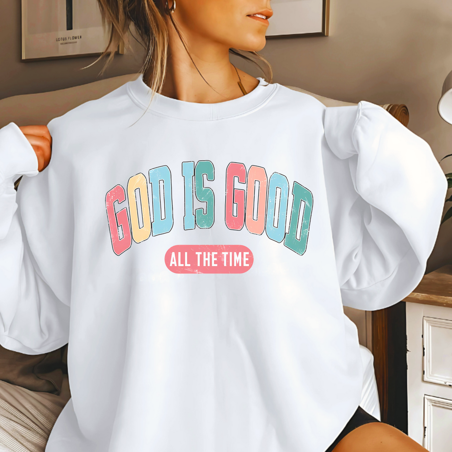 Woman wearing a white 'God Is Good' Christian sweatshirt, faith-based crewneck with inspirational design.