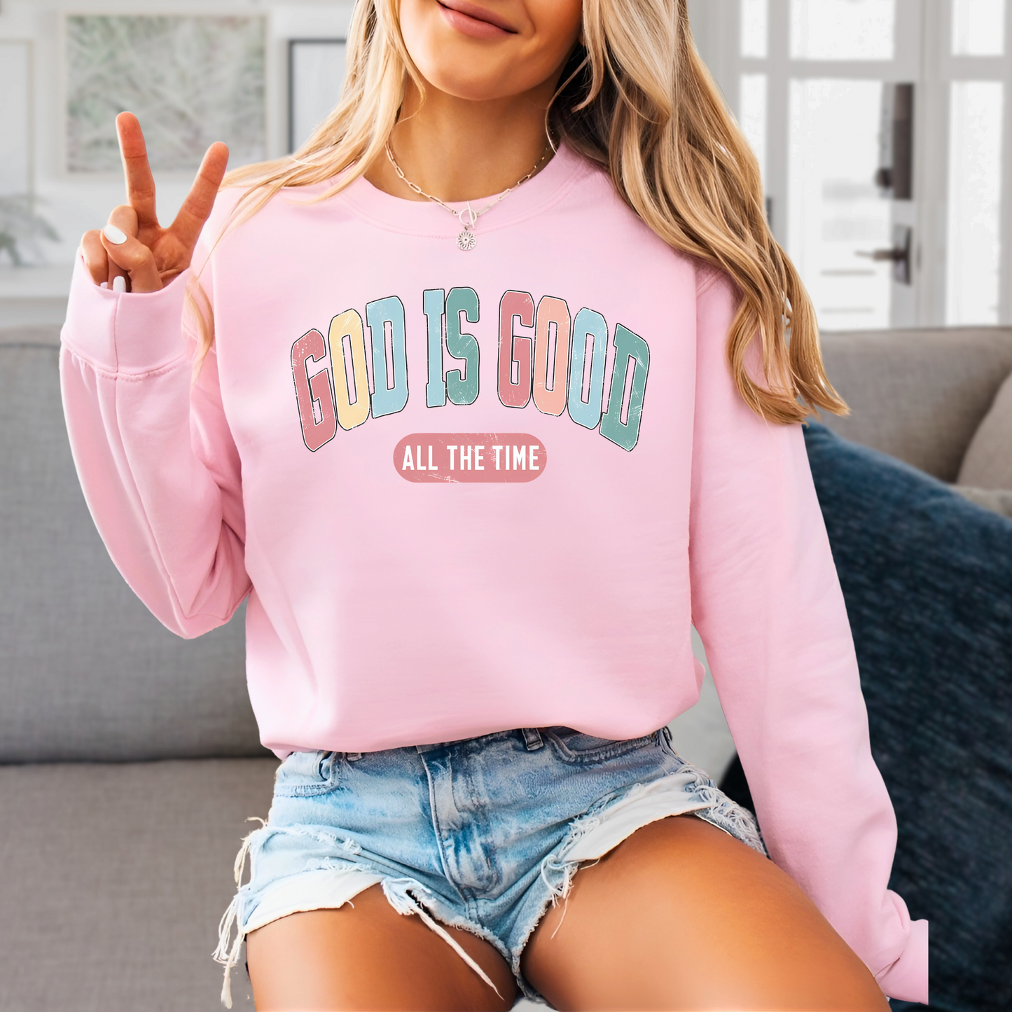 Pink 'God Is Good' sweatshirt, Christian Easter apparel for women, faith-based crewneck.