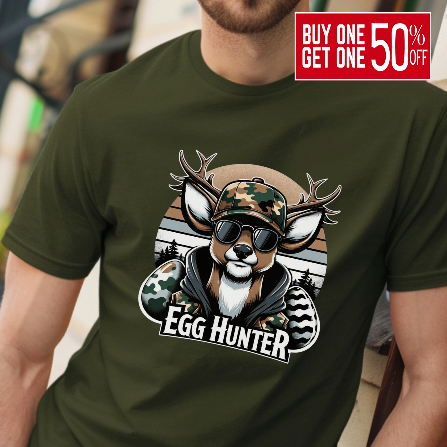 Military-green Egg-Hunter-Shirt featuring a camo deer with sunglasses and Easter eggs, perfect for hunters, veterans, and outdoor enthusiasts