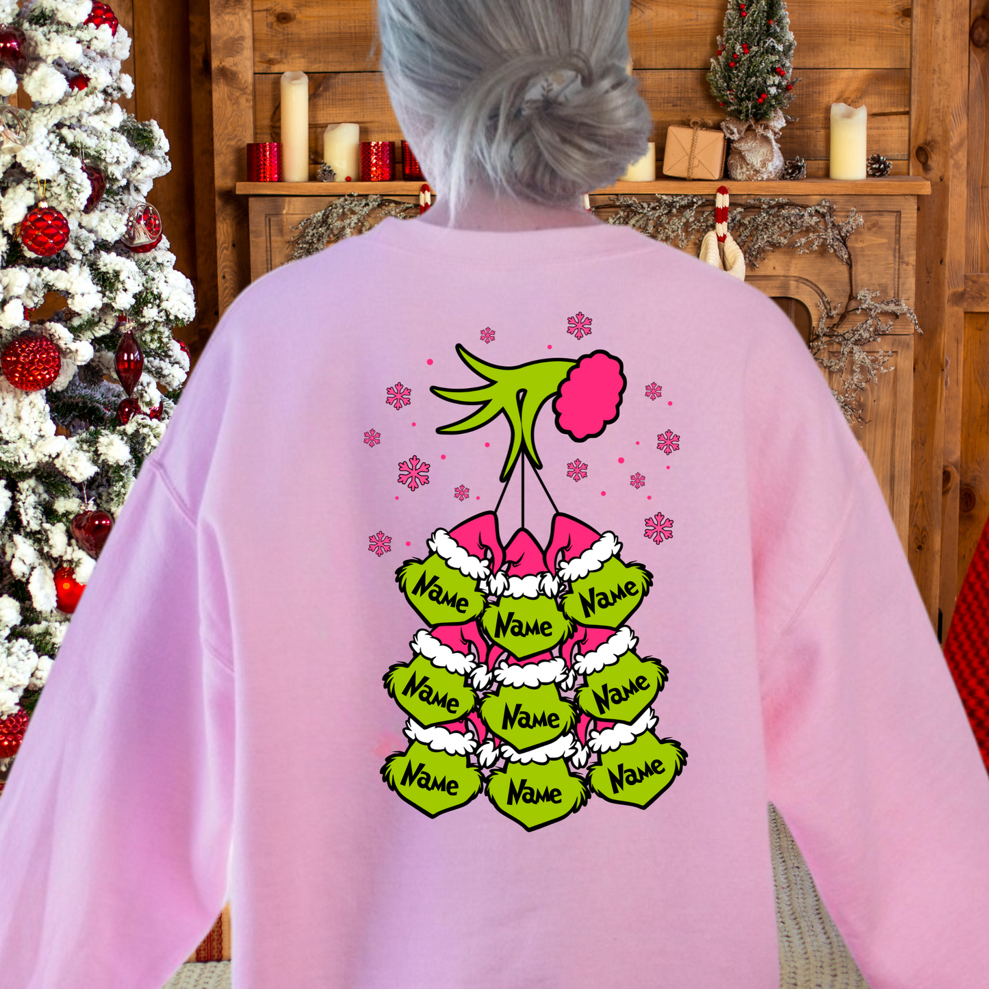 Back view of light pink sweatshirt with 9 personalized name ornaments