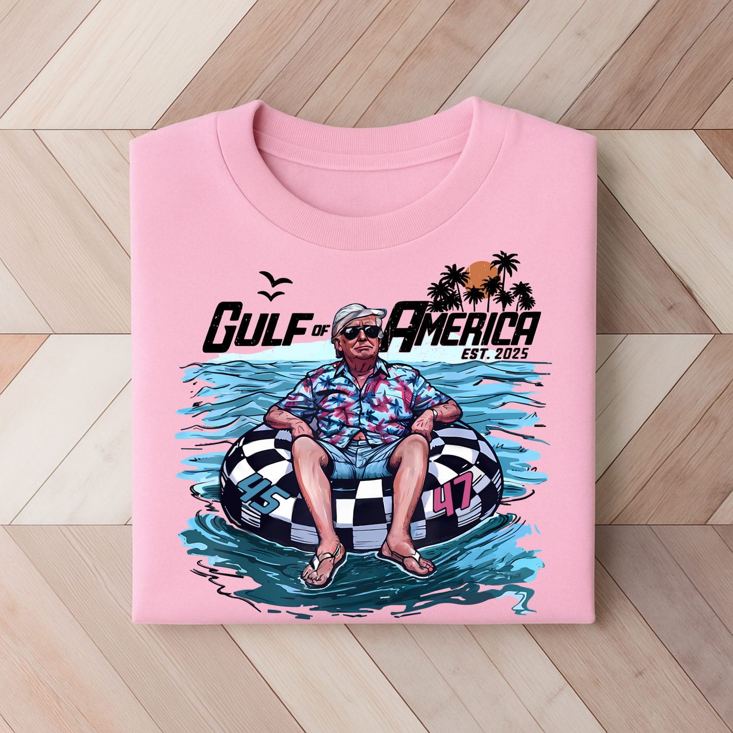“Light pink summer Trump tee with Gulf of America design and tropical water scene, bold conservative vibe.”