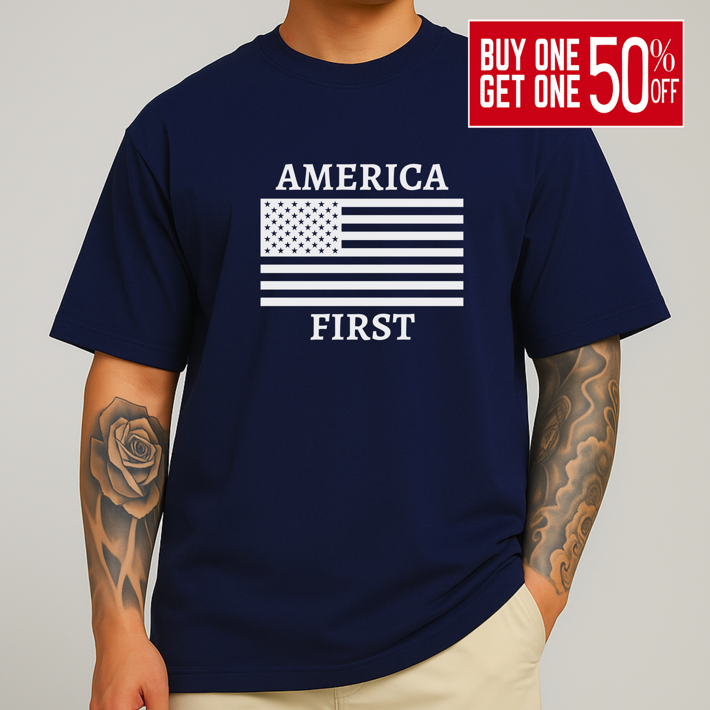 Man with arm tattoo wearing navy blue America First t-shirt with white flag print