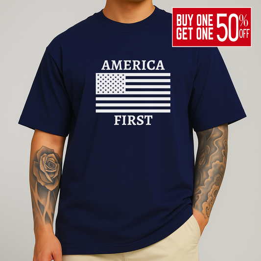 Man with arm tattoo wearing navy blue America First t-shirt with white flag print