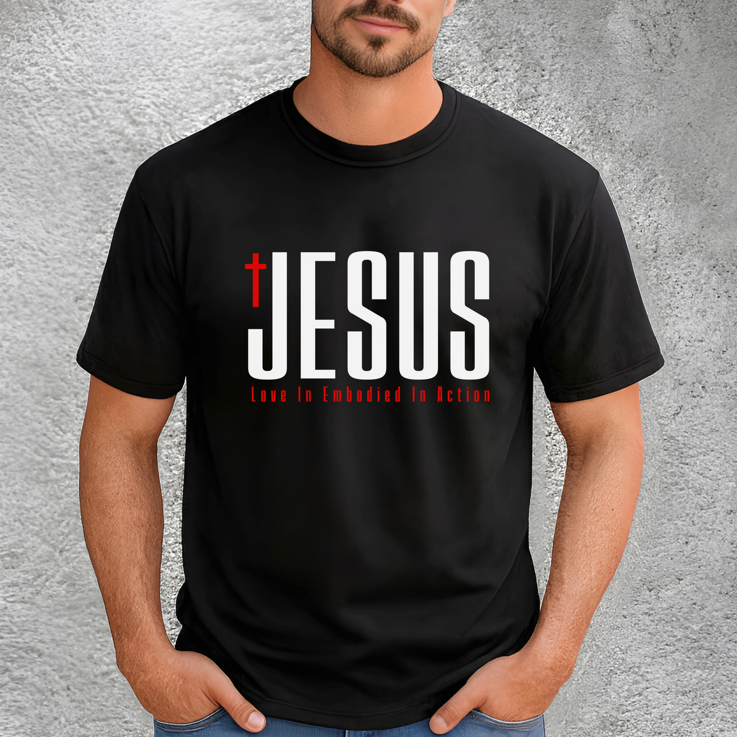 Men’s black JESUS T-shirt with bold cross design and “Love In Embodied In Action” text – Christian graphic tee S–3X, some colors in tall sizes.