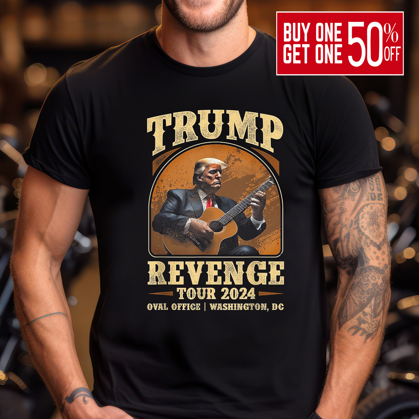Muscular man in black Trump Revenge Tour tee featuring guitar-playing Trump, shot in bar/garage setting