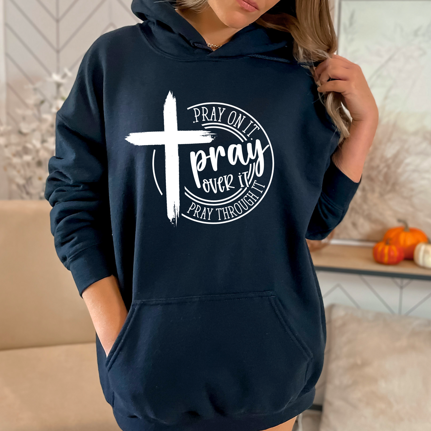 Woman wearing a Navy Blue Christian hoodie with a motivational prayer message and cross symbol.