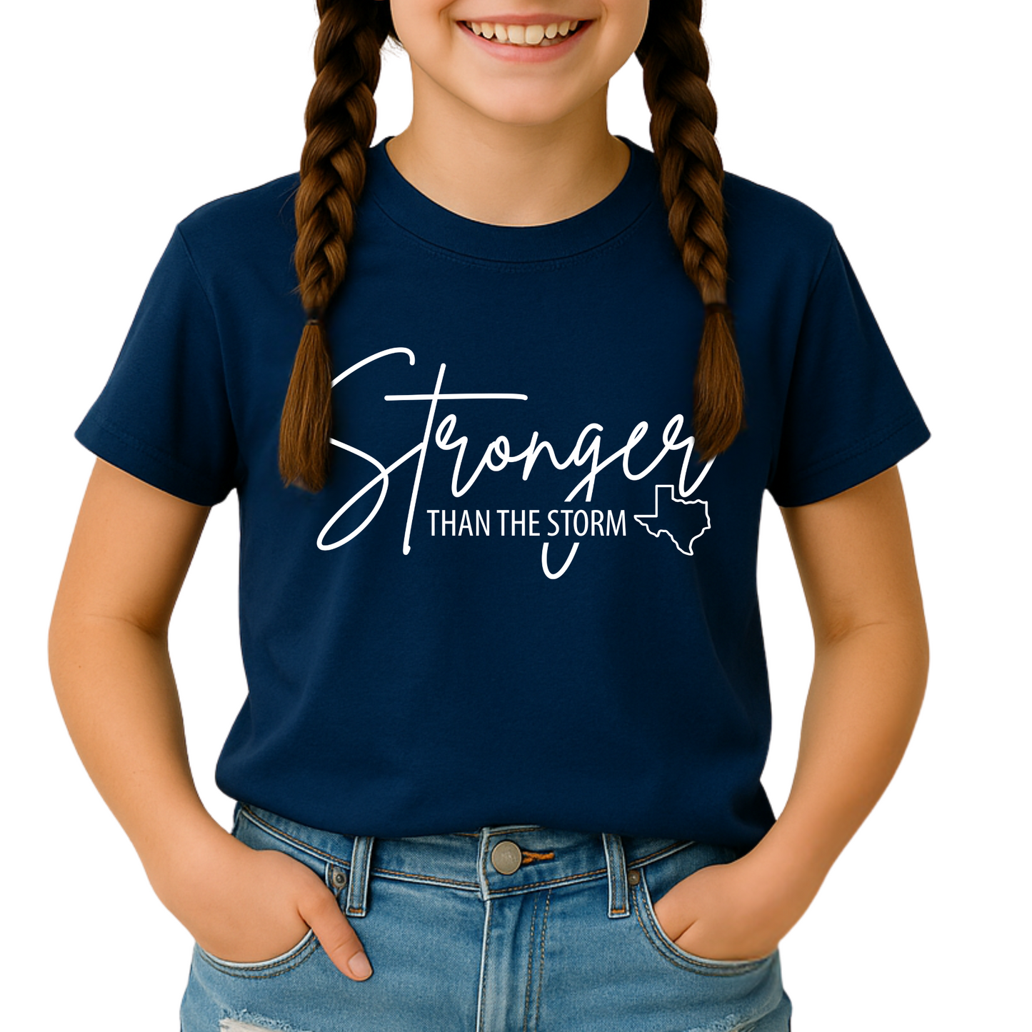 Navy blue “Stronger Than the Storm” youth Texas tee for girls, white text with Texas outline, braided hair style.