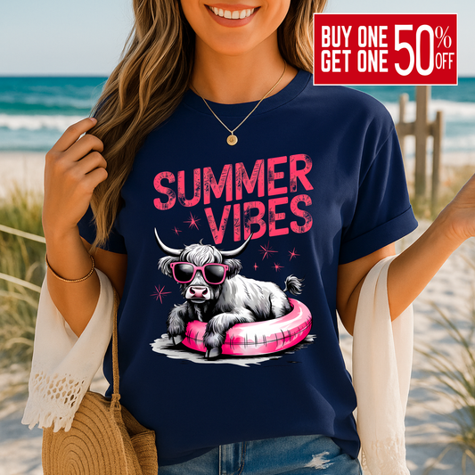 Navy t-shirt featuring Highland cow in float with sunglasses
