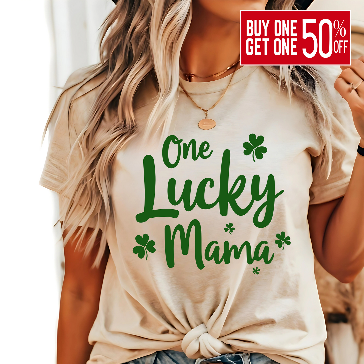 A stylish sand t-shirt with "One Lucky Mama" in green script, decorated with shamrocks. Perfect for moms celebrating St. Patrick’s Day in a cute and festive way.