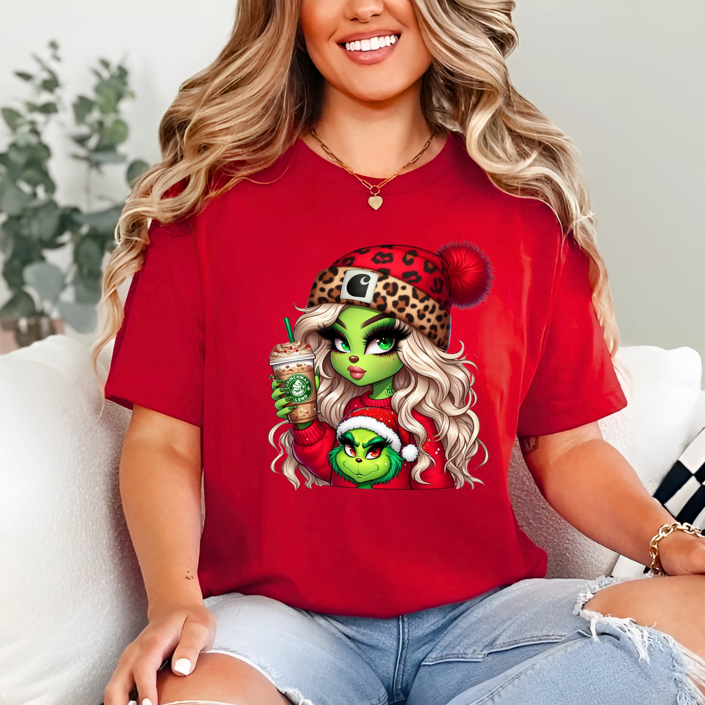 Woman wearing red Green Girl Christmas shirt holding coffee