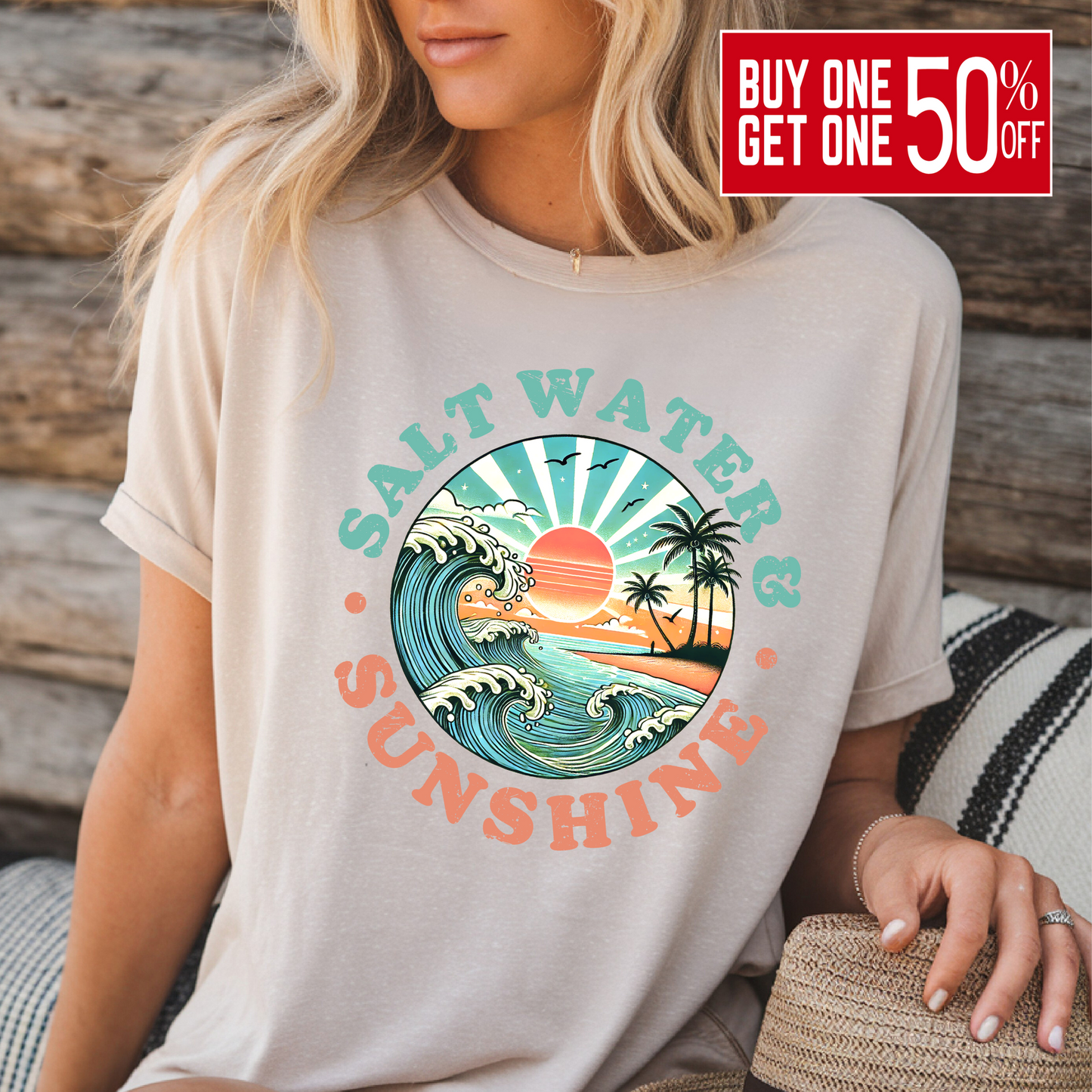 Sand-colored Salt Water & Sunshine tee, woman seated in front of wood background