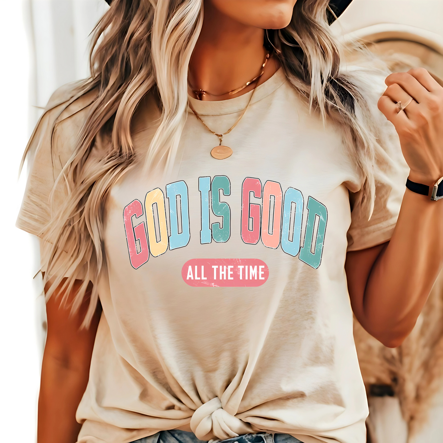 Woman wearing a Sand ‘God Is Good All The Time’ Christian t-shirt, faith-based graphic tee.