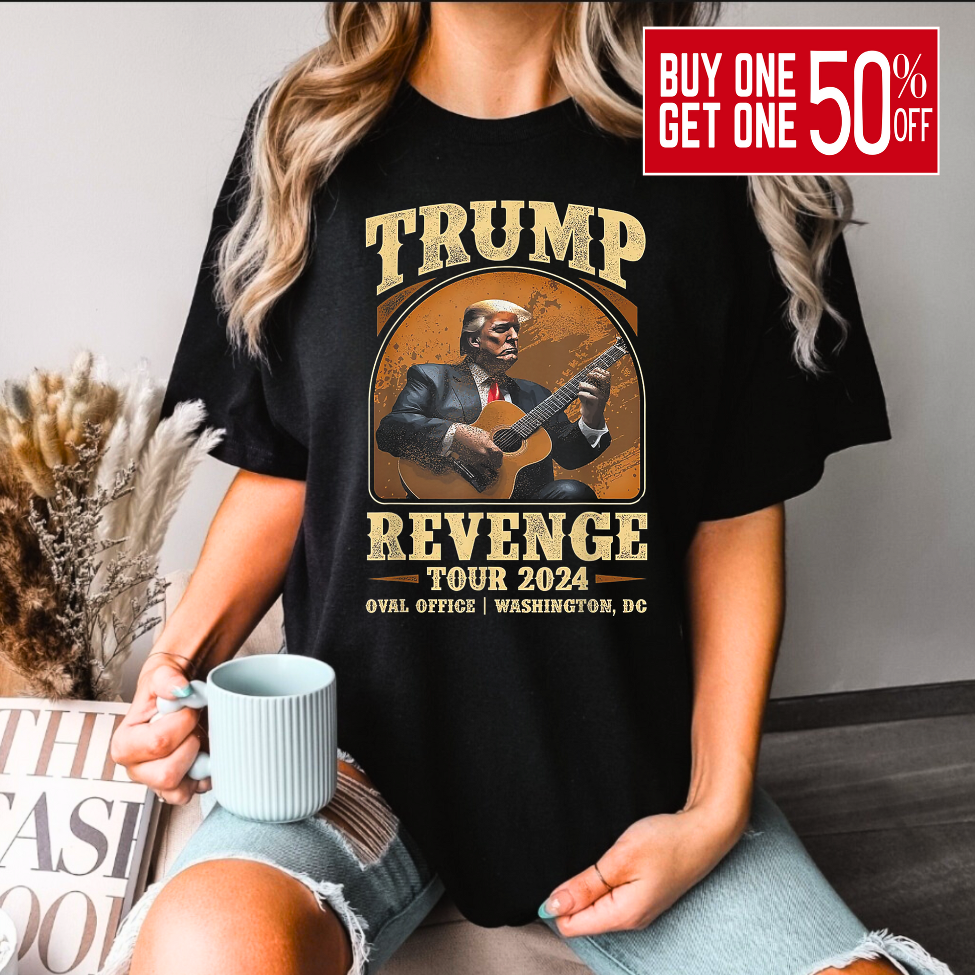 Bold black Trump 2024 revenge tee on woman sitting on a bench.