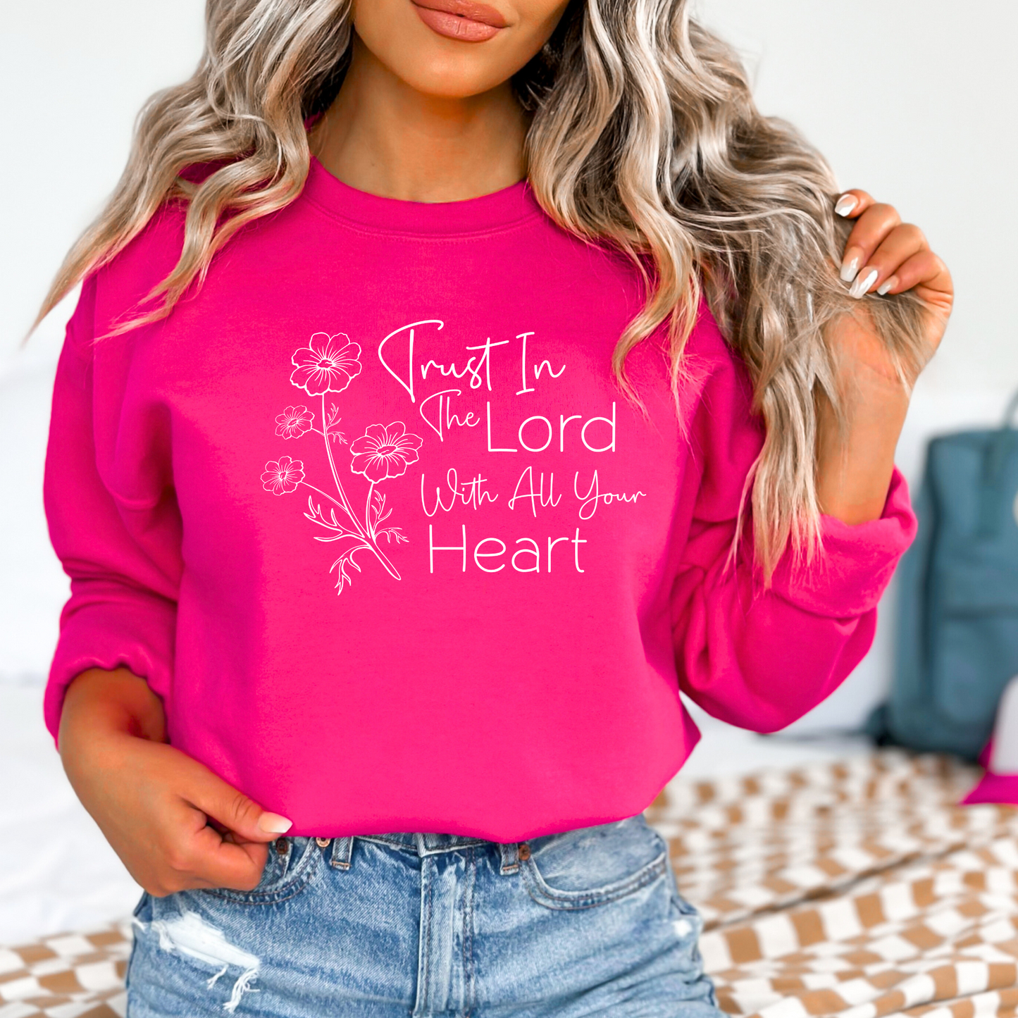 Christian sweatshirt with 'Trust in the Lord with all your heart' Bible verse design and floral illustration – Faith-based apparel for women