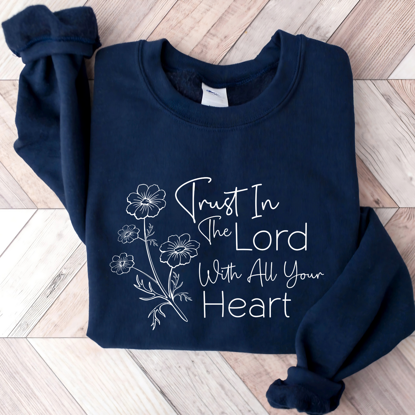 Christian sweatshirt with 'Trust in the Lord with all your heart' Bible verse design and floral illustration – Faith-based apparel for women
