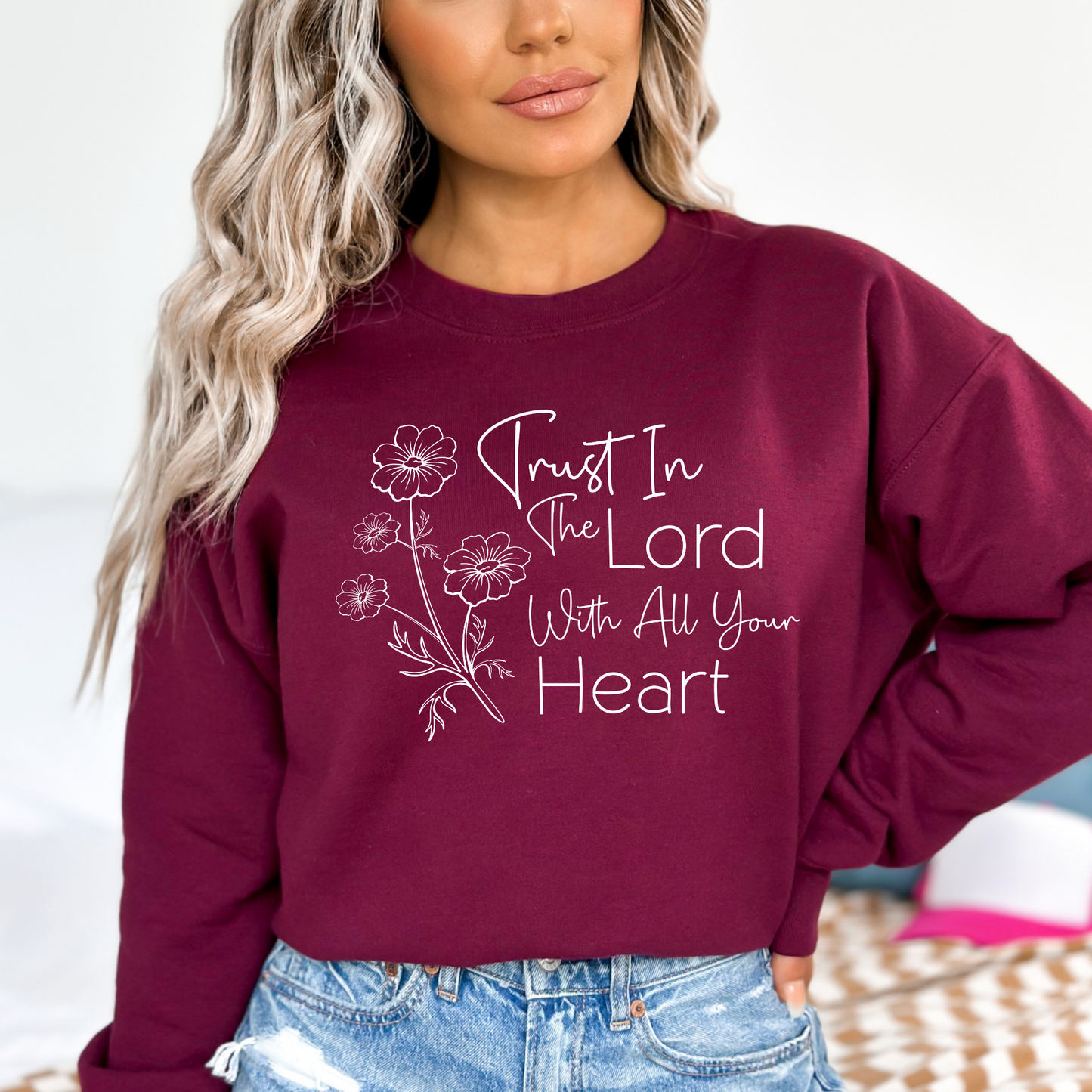Christian sweatshirt with 'Trust in the Lord with all your heart' Bible verse design and floral illustration – Faith-based apparel for women