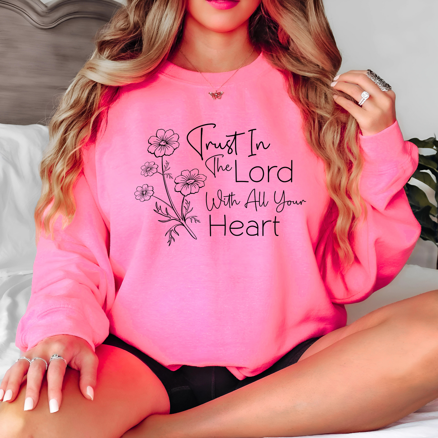 Christian sweatshirt with 'Trust in the Lord with all your heart' Bible verse design and floral illustration – Faith-based apparel for women