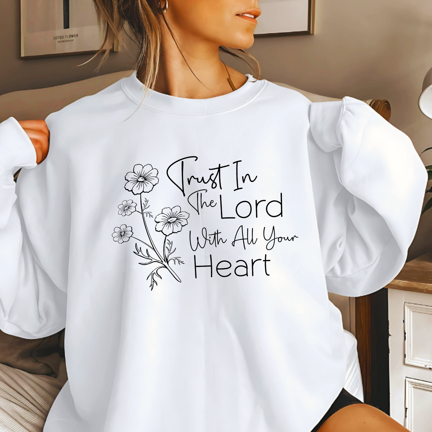 Christian sweatshirt with 'Trust in the Lord with all your heart' Bible verse design and floral illustration – Faith-based apparel for women