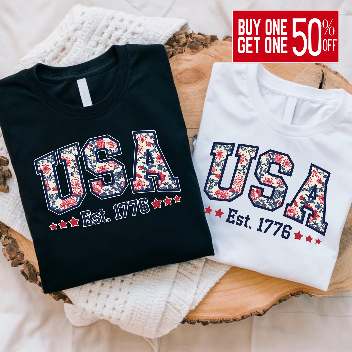 Flat lay of folded black and white USA floral shirts – Est. 1776 patriotic summer T-shirt set.