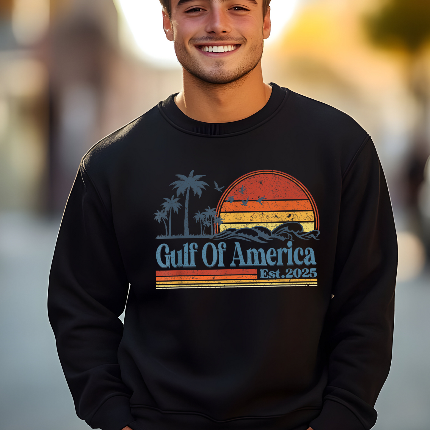 Man wearing black Gulf of America Est. 2025 sweatshirt with vintage sunset graphic