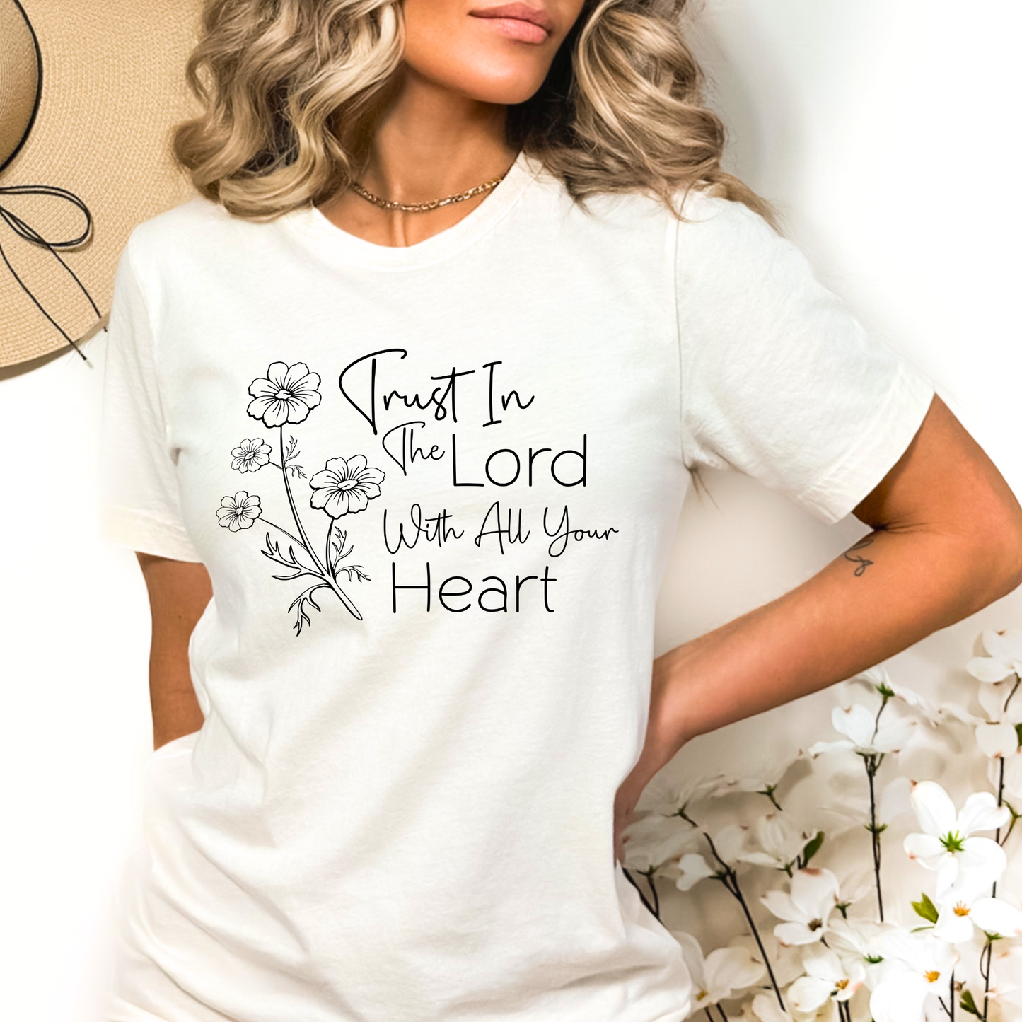 Christian faith T-shirt with ‘Trust in the Lord’ design, featuring elegant floral artwork and a Bible verse. Soft cotton, perfect for casual and church wear