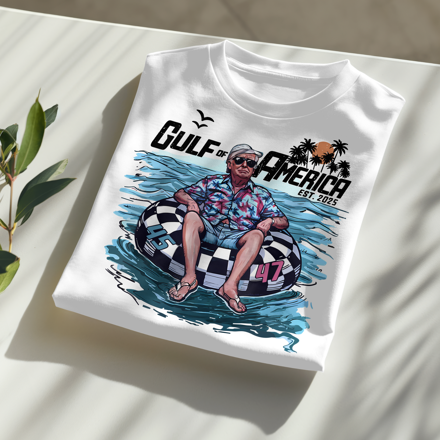 White Gulf of America Trump 2025 shirt with cartoon beach design and patriotic theme.