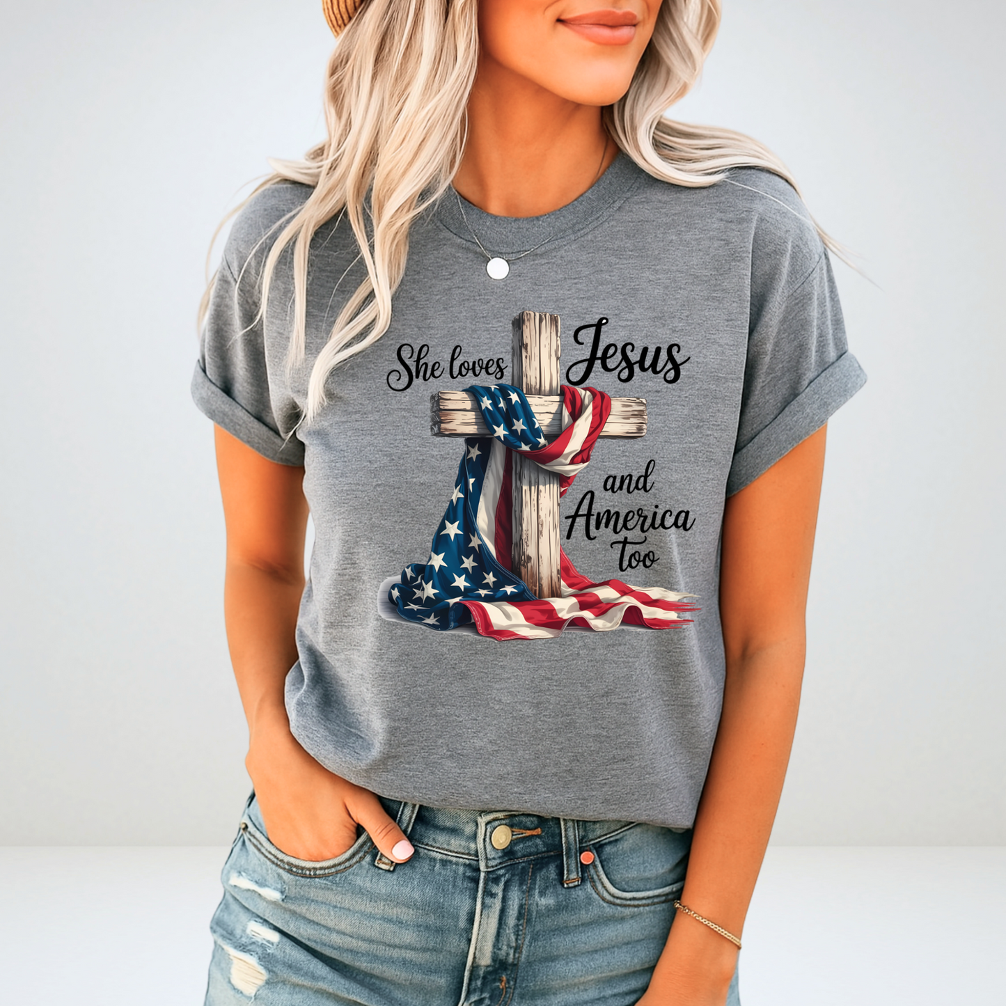 Woman in gray patriotic Christian tee with flag and cross design