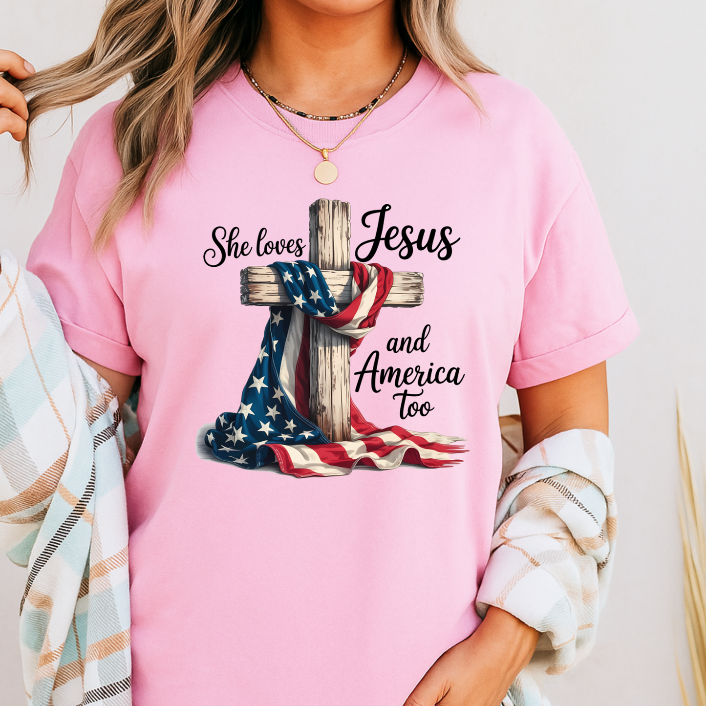Woman in pink patriotic Christian tee with flag and cross design