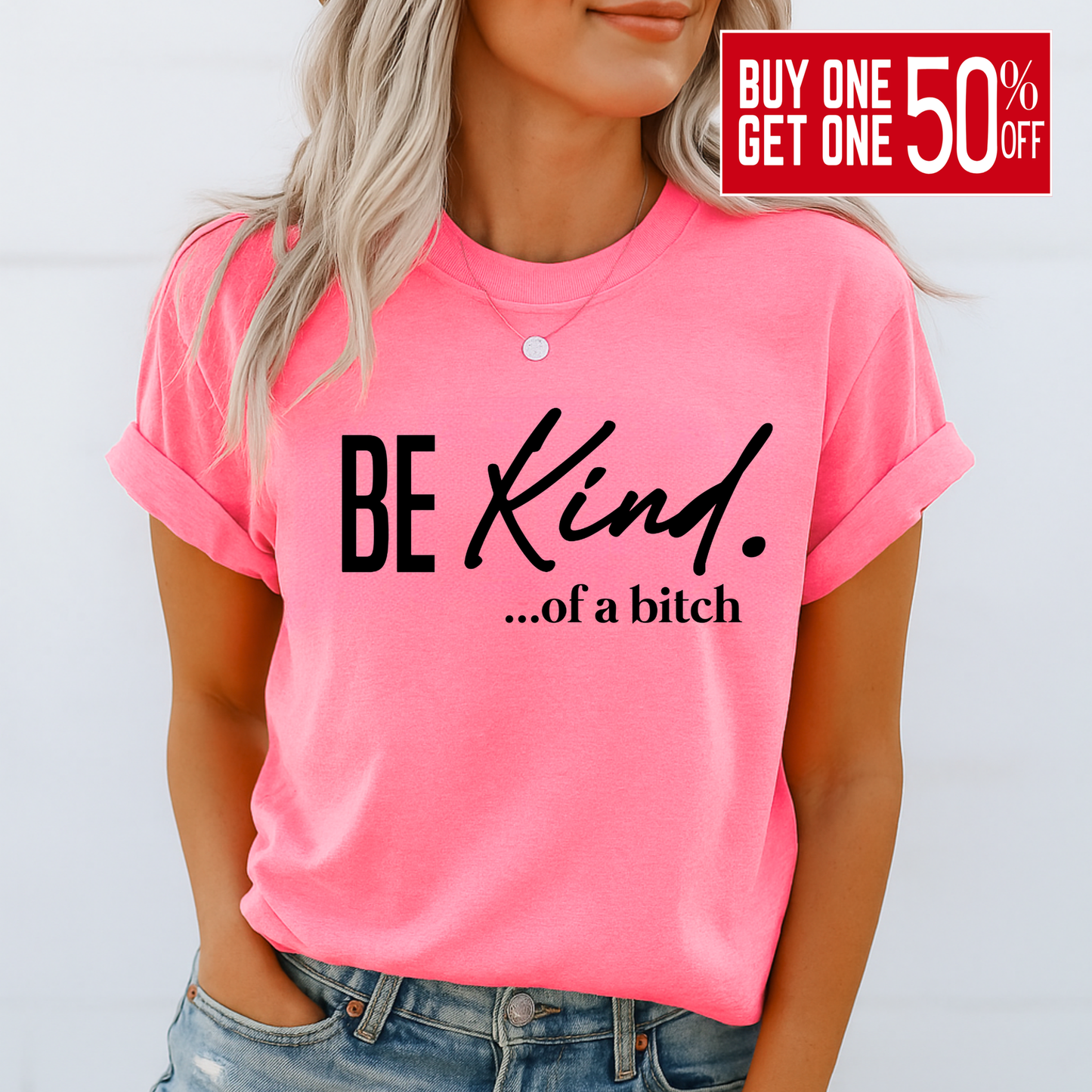 Woman wearing bright pink shirt with bold sarcastic “Be Kind…of a bitch” text