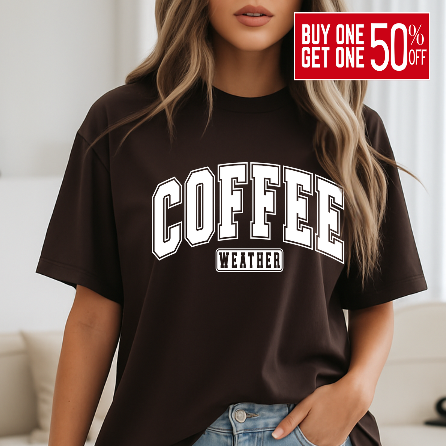 Woman wearing brown "Coffee Weather" shirt standing by bed, cozy fall look