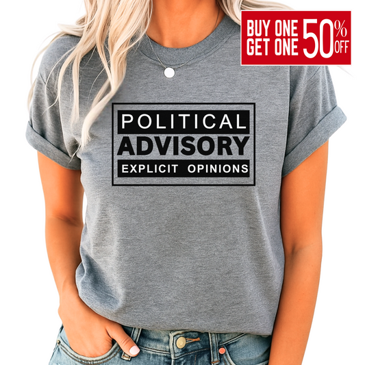 Woman wearing gray conservative “Political Advisory” t-shirt with black print, rolled sleeves and jeans.