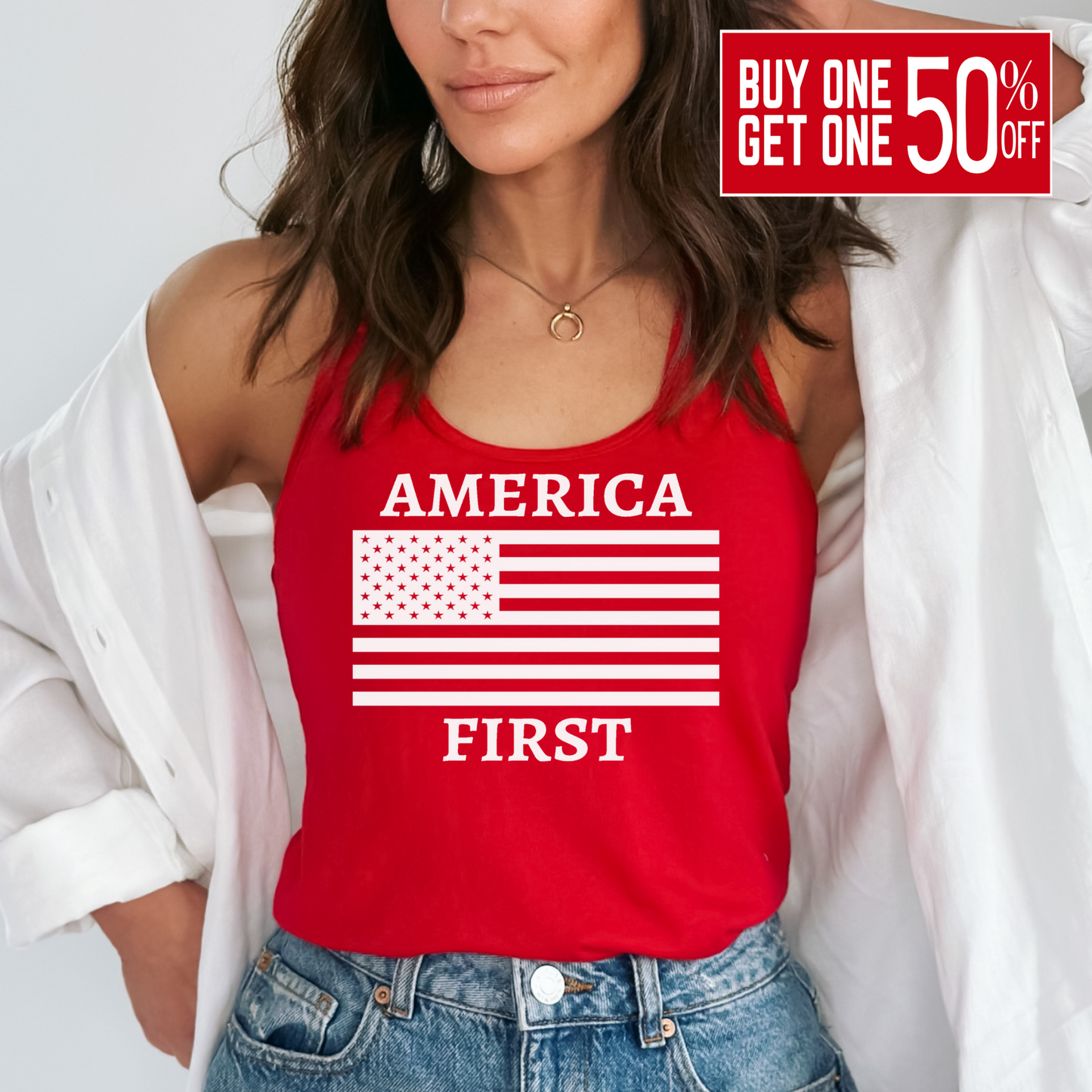 Woman wearing red tank with bold white America First and flag graphic, styled with denim