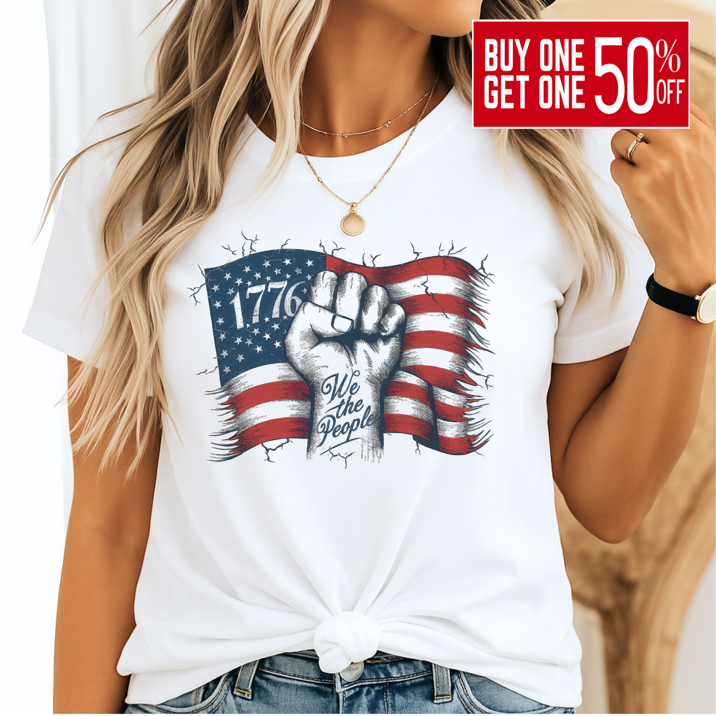 Woman wearing white 1776 We The People shirt with blue jeans, smiling – front view.
