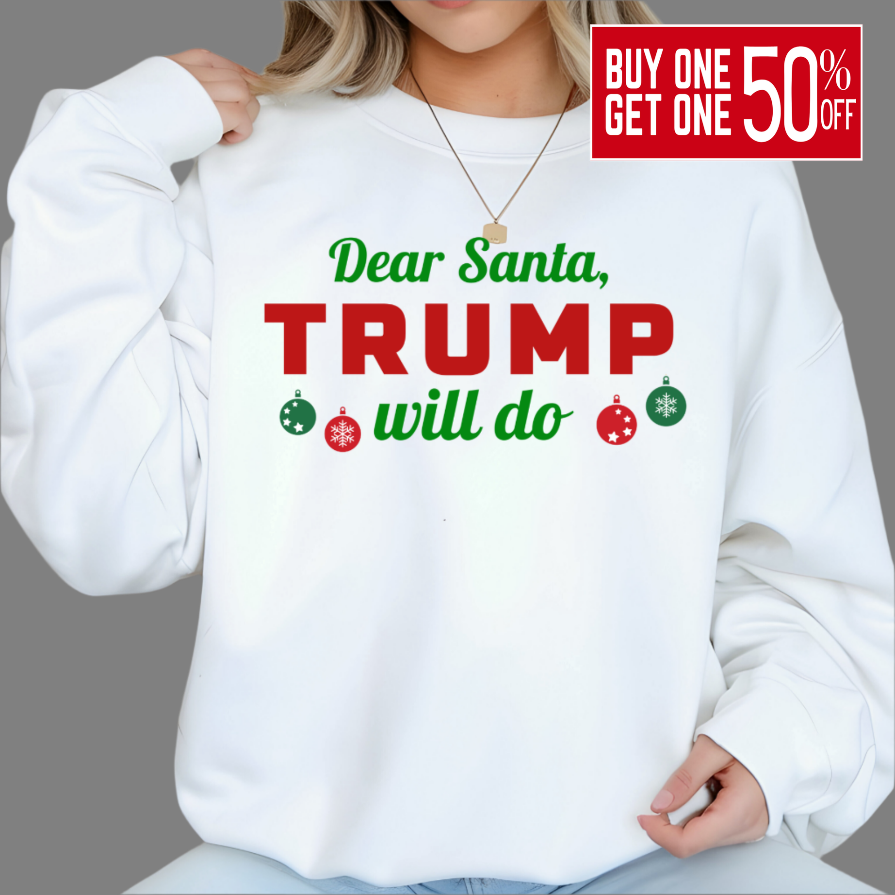 Woman wearing white “Dear Santa, Trump Will Do” Christmas sweatshirt with red and green lettering